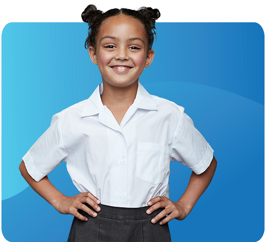 Confident young girl stands smiling against a blue background