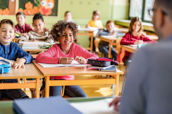 smiling students engaged in classroom discussion